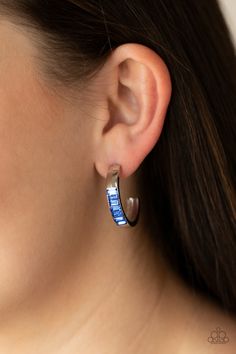 The front of a thick silver hoop is encrusted in glittery blue emerald cut rhinestones, creating a glamorous pop of color. Earring attaches to a standard post fitting. Hoop measures approximately 1" in diameter.

 Sold as one pair of hoop earrings. Textured Gold Ring, Trendy Fringe, Emerald Style, Blue Emerald, Oil Spill, Jewelry Images, Paparazzi Accessories, Blue Gems, Paparazzi Jewelry