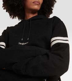 Cotton jersey hoodie in black - Saint Laurent | Mytheresa Long Sleeve Hoodie With Logo For Loungewear, Logo-detailed Long Sleeve Hoodie For Loungewear, Sporty Hoodie With Logo Detail For Loungewear, Fall Loungewear Hoodie With Logo, Fall Hoodie With Logo Detail For Loungewear, Logo Detail Hoodie For Fall Loungewear, Fall Loungewear Hoodie With Logo Detail, Sporty Hooded Sweatshirt With Ribbed Collar, Winter Sporty Hoodie With Logo Detail