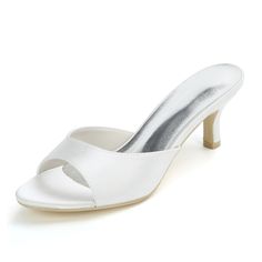 a white high heeled shoe with an open toe