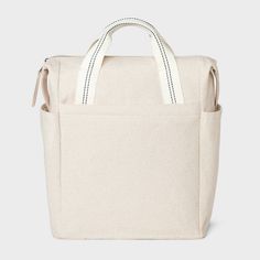 a white canvas bag with handles and straps