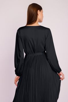 Our stunning Long Sleeve Pleated Satin Maxi Dress is an elegant and fashionable addition to your evening wear collection. Featuring long puffed sleeves, a crossover front with a dainty waist tie, and a long pleated satin skirt, this beautiful ensemble is the ideal choice for any party or formal event. Pleated Satin Skirt, Satin Maxi, Satin Maxi Dress, Satin Skirt, Long Puff Sleeves, Puffed Sleeves, Skirt Design, Women's Wardrobe, Long Sleeve Maxi Dress