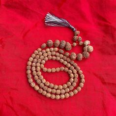 "Dimension:- Weight         : 43 Grams  Length          : 20.5\" Inches  Bead Size     : 7-20 MM (Small to big) No. of Beads : 107 Beads Shape            : Oval & Round Faces             : 1-14 Face, Ganesh, Gauri Shankar  Color              : Brown  Uses               : Meditation, Prayer  Certified by  : Rudraksha & Gems Testing Lab This is a divine Rudraksha Siddha Mala. Lab Certified 107 bead Rudraksha Siddha Mala Consist of 1 to 14 Mukhi, Gaurishankar, Ganesha Beads Rudraksha Mala.  Other items from our shop you may like it:- https://naturalcrystalshub.etsy.com/listing/1071204570 https://naturalcrystalshub.etsy.com/listing/1085151419 PACKAGING DETAILS:- We Wrap the product with multiple layers of bubble wrap and secure it with tape. We place the wrapped product in a suitable wooden or Festive Multicolor Spiritual Temple Necklace, Handmade Spiritual Mala For Puja, Handmade Temple Jewelry Beads For Rituals, Spiritual Round Beads Mala For Puja, Spiritual Mala With Round Beads For Puja, Spiritual Mala For Puja With Round Beads, Hand-strung Spiritual Mala For Puja, 8mm Beaded Mala For Festivals And Gifts, Spiritual Necklaces For Navratri