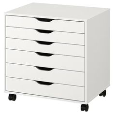 a white cabinet with five drawers and four casteors on the bottom, three black wheels