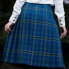 "Medium Weight Pleated Ladies' Kilted Skirt The Fiona Skirt is pleated all the way around for style and comfort. Don't let the boys have all the fun! Our medium-weight Fiona kilted skirt is our solution to a woman's kilt. Whether you're matching your date or flying solo like the strong Celtic lady you are, this kilted skirt will give you an excuse to wear tartan! Choose from several tartans to match your family's ancestral tartan and your personal style. It is available in approximately 18-28″ i Green Accordion Pleats Skirt, Green Fitted Skirt With Pleated Hem, Fitted Green Skirt With Pleated Hem, Fitted Green Accordion Pleated Skirt, Casual Blue Skirt With Accordion Pleats, Fitted Blue Skirt With Pleated Hem, Green Pleated Preppy Skirt, Fitted Blue Bottoms With Accordion Pleats, Preppy Green Pleated Skirt