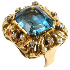 A aquamarine, pearl and diamond ring in a floral design in yellow gold from the Retro period, 1940s. The ring centres a big aquamarine, ca. 16 carats and it is accentuated by round brilliant cut diamonds and pearls. Ring With Gemstone, Vintage Cluster Ring, Enchanted Jewelry, Gemstone Rings Vintage, Rings Luxury, Pearl And Diamond Ring, Vintage Fine Jewelry, Fine Diamond Jewelry, Retro Ring