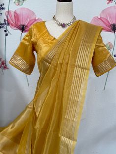 Amazing silk mark certified Benarasi tissue saree blouse size 36-40 fall & pico done. Comes with in-skirt Exclusive sarees from Haas Slub Silk Saree With Sheer Dupatta, Festive Saree With Sheer Dupatta In Slub Silk, Gold Bollywood Style Pre-draped Cotton Silk Saree, Festive Slub Silk Saree With Sheer Dupatta, Gold Cotton Silk Anarkali Set With Traditional Drape, Gold Slub Silk Sets For Navratri, Bollywood Style Slub Silk Blouse With Sheer Dupatta, Gold Slub Silk Anarkali Set For Diwali, Navratri Pre-draped Tussar Silk Saree With Sheer Dupatta