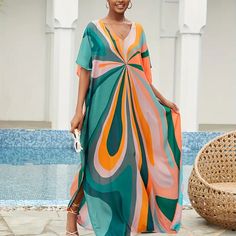 Bright Colorful Colorblock V-Neck Maxi Dress - Beach Cover-Up Dress Details Maxi Length / Batwing Sleeves / V-Neckline / Oversized Fit Fabric 100% Viscose Color Multicolor Vibrant Green V-neck Maxi Dress, Summer Multicolor V-neck Maxi Dress, Colorful V-neck Dress For Day Out, Multicolor Retro Beach Dress, Summer Beach Color Block Maxi Dress, Casual Beach Maxi Dress With Color Block, Color Block Maxi Dress For Vacation, Multicolor Flowy V-neck Maxi Dress, Casual Beach Color Block Maxi Dress