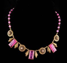 This fabulous antique Czech necklace has the most exotic colors of pink in swirls like slag glass.  All the pink glass beads on the necklace are also made with the swirls. The stones are open back and it is in very very good condition. 5-2-19 Formal Pink Cabochon Necklace, Pink Vintage Necklace For Formal Occasions, Vintage Pink Necklace For Formal Occasions, Pink Cabochon Necklaces For Jewelry Making, Antique Pink Necklaces For Wedding, Collectible Pink Pendant Jewelry, Antique Handmade Pink Necklaces, Vintage Pink Necklace With 17 Jewels, Antique Handmade Pink Necklace