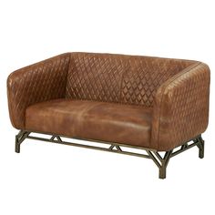 a brown leather couch sitting on top of a metal frame