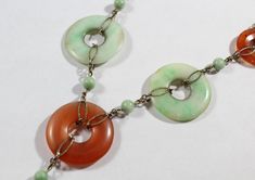 -Antique Chinese Sterling Silver Disk Natural Carnelian with Jadeite Necklace -Total length: 15.5 in -Small disk carnelian size:about 17.75 mm -Jadeite disk & big carnelian disk size: 25 mm -Jadeite pendant size: 21 mm x 13 mm x 3.4 mm (thickness) -Small jadeite bead size:about 5 mm -Total weight: 18.5 g -Marked sterling Vintage Jade Necklace With Natural Stones, Vintage Natural Stones Gemstones, Vintage Round Natural Gemstones, Vintage Oval Jade Necklace, Green Multi-stone Round Necklace, Green Multi-stone Round Necklaces, Coral Earrings, New City, Earrings Photo