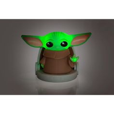 the child yoda lamp is glowing green