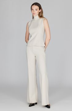 A classic wide leg pant with all the right details. Cut in a comfortable and luxurious Italian double face fabric, this full length pant has a beautiful drape and weight and is finished with a simple back zip to maintain a clean front. NOTE: This pant runs generously and most people have sized down from their typical Mi Jong Lee pant size. Elegant Wide Leg Viscose Bottoms, Chic Formal Viscose Pants, Chic Evening Bottoms With Straight Hem, Elegant Wide Leg Pants For Workwear With Structured Boning, Viscose Wide-leg Pants For Formal Occasions, Formal Viscose Wide-leg Pants, Elegant Wide Leg Pantsuit, Elegant Tailored Wide Leg Pants With Straight Hem, Elegant Viscose Bottoms For Workwear