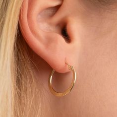 Meet our Gold Flat Hoops! Substantial, but light weight and with a durable clasp. 14k Gold Filled Clasp Closure Available in Hoop Diameter 18mm, 22mm, 25mm, and 35mm Classic Everyday Hypoallergenic Huggie Earrings, Classic Round Hypoallergenic Huggie Earrings, Classic Small Hoop Jewelry For Everyday, Classic Single Earring For Everyday, Classic Adjustable Hoop Earrings For Anniversary, Classic Adjustable Hoop Earrings For Everyday, Classic Hypoallergenic Huggie Jewelry, Classic Everyday Pierced Huggie Earrings, Classic Pierced Huggie Hoop Earrings