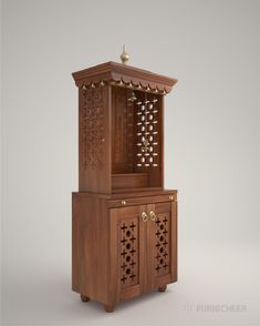 a wooden cabinet with carvings on the front and side doors, sitting against a gray background