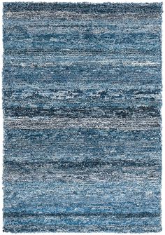 a blue and white rug with stripes on the bottom, in shades of grays