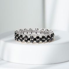 Product Details Enhance your style with the sparkling beauty of this black spinel ring, designed to bring a touch of glamour to your life. The round-cut black spinel, securely nestled in a prong setting on a full eternity band, adds versatility to this exquisite piece, making it suitable for any outfit or occasion. Product Information SKU SHP-RINGS0821188905 Width 2.7 mm Height 4.8 mm Weight 2.72 gm (Approximate) BLACK SPINEL INFORMATION No.of Stones 57 Pieces Total Weight 1.71 Carat (Approximat Black Spinel Ring, Spinel Ring, Eternity Rings, 18k Yellow Gold Ring, Black Spinel, Eternity Band, Eternity Bands, Yellow Gold Rings, Eternity Ring