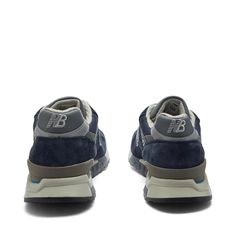 Capture the timeless Americana style of New Balance with their U998NV Made in USA sneakers. Navy leather and suede ups exude both durability and vintage flair, while ABZORB cushioning provides unbeatable comfort for your daily adventures. Proudly stepping in a symbol of quality craftsmanship, the iconic 'N' logo and 'Made in USA' badge honor NB's dedication to heritage manufacturing. Jordan Alexander, Usa Navy, Navy Sneakers, End Clothing, N Logo, Round Toe Sneakers, Prada Eyewear, Balance Sneakers, Americana Style