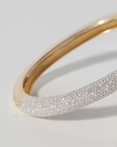 Classic: 14k solid gold 809 round, natural diamonds: Total carat weight: approximately 3.99 Color: G-H Clarity: SI Diamond coverage: halfway around bangle Width: 6 mm Oval, hinged bangle Push clasp closure Formal 14k Gold Diamond Bangle Bracelet, Dazzling Diamond Sparkling Bangle Bracelet, Dazzling Sparkling Diamond Bangle Bracelet, Classic Diamond Pave Bangle Bracelet, Classic Bangle With Pave Setting For Anniversary, Timeless Bangle With Pave Setting, Round Diamond Bracelet Fine Jewelry, Sparkling Round Diamond Bracelet Fine Jewelry, Sparkling Diamond Fine Jewelry Bracelet