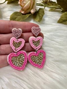 Valentines isn't the only day to show your love! These super cute pink heart earrings are lightweight and fun for any day! Trendy Dangle Heart Earrings For Valentine's Day, Fun Pink Heart-shaped Jewelry, Sweet Pink Jewelry With Heart Beads, Sweet Pink Dangle Heart Earrings, Sweet Pink Heart Dangle Earrings, Cute Pink Double Heart Jewelry, Sweet Pink Heart-shaped Earrings, Sweet Pink Drop Earrings, Fun Pink Earrings For Pierced Ears