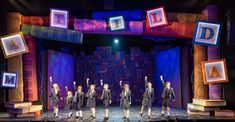 the cast of matilda on stage during a performance