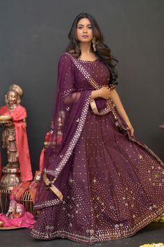 Plum Purple mirror work lehenga choli Matched with Purple mirror work blouse with quarter sleeves. Designed with round neck and has back hooks. Set together with a matching soft net purple duppata with mirror work and have gold border The length of the blouse is 14 inches. Blouse can fit a size 32 to 42 The maximum length of the lehenga will be 41 inches. Slight variation in color is possible due to digital photography. This is a 3 piece set. Care: dry clean only We provide side fitting/sleeves Purple Dori Work Sharara For Eid, Purple Dola Silk Sharara With Gota Work, Purple Sharara With Sheer Dupatta And Traditional Drape, Purple Gota Work Dola Silk Sharara, Purple Sharara With Sheer Dupatta In Traditional Drape, Traditional Purple Sharara With Sheer Dupatta, Floor-length Sharara With Mirror Work For Navratri, Floor-length Mirror Work Sharara For Navratri, Purple Chinon Dupatta For Party