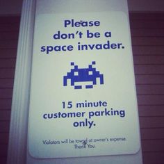 a parking sign that says, please don't be a space invade 15 minute customer parking only