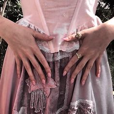 two hands on the back of a woman's dress