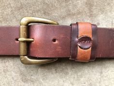 "Orvis thick heavy duty leather belt. Solid brass buckle. Marked a size 36. Made in USA. Good gently used condition.  Fits a size 34.5\"-38.5\" waist on 5 notches. Recommended for 34\"-36\". A tad less than 1.5\" wide." Vintage Belts And Suspenders For Everyday Use, Vintage Belts With Brass Buckle For Everyday Use, Vintage Belts And Suspenders With Removable Belt, Brown Belt With Buckle For Everyday Use, Suspender Belt, Brass Buckle, Leather Buckle, Last Minute Gifts, Smooth Leather