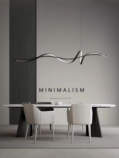 the minimalism dining table is surrounded by white chairs