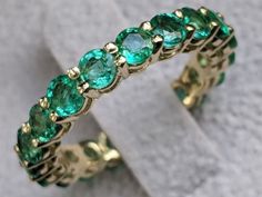 Stunning 3 carat certified emerald low set 14K yellow gold band setting. Band features 19 round cut, natural green emerald of 3.5mm. The ring is meticulously handcrafted with great care and attention to every detail. Ask me anything on live chat! http://bit.ly/DiamondsMineChat In order to make your decision easier we offer: ♥ FREE FedEx or USPS Shipping - Sent With a Tracking Number ♥ FREE Luxury Gift Box ♥ FREE Certificate of Authenticity & Appraisal ♥ 14 Days Money Back Guarantee - No Ques Emerald Eternity Ring, Emerald Eternity Band, Emerald Wedding Band, Emerald Rings, Emerald Wedding, Bespoke Engagement Ring, Art Deco Diamond Rings, Aquamarine Engagement Ring, Rose Gold Diamond Ring