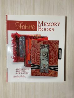 the front cover of a book about fabric memory books