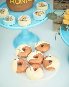 there are many donuts on the table and one is decorated with winnie the pooh