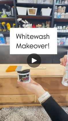 a person is holding a paint can in front of a dresser with the words whitewash makeover on it