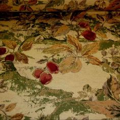 a close up view of the fabric with flowers and leaves on it's surface