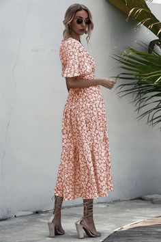 Breezy V-neck Maxi Dress For Beach Season, V-neck Floral Print Maxi Dress For Beach, Summer Printed Maxi V-neck Dress, Breezy Pink V-neck Maxi Dress, Pink V-neck Sundress, Pink V-neck Sundress For Beach, V-neck Floral Print Beach Dress For Brunch, Beachy V-neck Maxi Dress For Day Out, Pink V-neck Dresses For Vacation