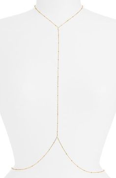 Glam up your look with this dainty body chain detailed with beaded stations for elegant sparkle. 18k-gold plate or sterling silver plate Made in the USA or imported Minimalist Gold Body Chain, Gold Beaded Chain Adjustable Body Jewelry, Delicate Adjustable Gold Body Chain, Gold Pearl Chain Body Chain As Gift, Gold Pearl Body Chain For Gift, Delicate Gold Body Chain, Minimalist Gold Lariat Body Chain, Gold Body Jewelry With Pearl Chain As Gift, Gold Body Jewelry With Pearl Chain For Gift