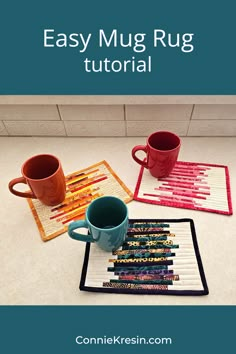 coffee mug rug with crayons on it and two cups sitting next to each other