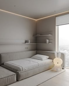 a white bed sitting next to a window in a bedroom