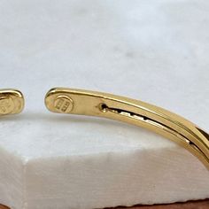 14KT yellow gold oval, knife-edge, slip-on cuff bangle bracelet. Great, lightweight piece for layering! A modern look! Measures 6 + 5/8" Around Width: 5.5mm Slip On; No Clasp Hollow bangle Weight: 4.90 grams Finished on all sides Stamped 14K Made in Italy Adjustable Yellow Gold Cuff Bracelet For Everyday, Adjustable Oval Bangle With Polished Finish, Adjustable Oval Modern Cuff Bracelet, Adjustable Oval Yellow Gold Bangle, Adjustable Modern Yellow Gold Bangle, Modern Adjustable Bangle For Anniversary, Modern Adjustable Oval Bangle, Adjustable Oval Gold Cuff Bracelet, Adjustable Gold Oval Cuff Bracelet