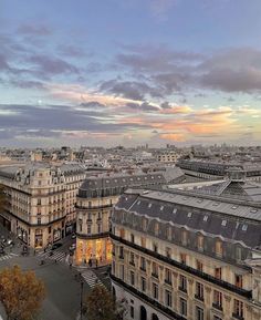 an aerial view of paris at dusk with the eiffel tower in the distance