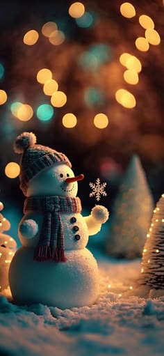 a snowman with a hat and scarf standing in the snow next to christmas trees