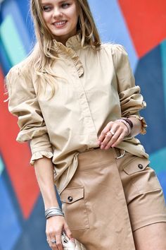 Some shirts simply make you happy the moment you slip them on. This whimsical blouse is one of them. With its ruffle-trimmed collar and sleeves adding a playful touch, this button-down beauty conjures images of twirling through a field of wildflowers on a perfect summer day. Yet its crisp cotton fabric and tailored cut mean it works just as well for that important meeting or client lunch. Versatile, flattering and mood-boosting all at once, this blouse pulls double duty as both a style staple an Spring Blouse With Ruffle Hem For Work, Spring Workwear Blouse With Ruffle Hem, Spring Tops With Peter Pan Collar And Button Cuffs, Spring Tops With Button Cuffs And Peter Pan Collar, Long Sleeve Ruffled Shirt For Day Out, Ruffled Long Sleeve Shirt For Day Out, Long Sleeve Ruffle Shirt For Day Out, Long Sleeve Shirt With Ruffles For Day Out, Casual Shirt With Peter Pan Collar And Ruffles