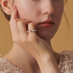 Adorn your every day look with a sparkle of luxury with this Oval Opal Ring. Expertly crafted with gold on silver, this elegant ring features an intricate setting and a gleaming opal to ensure that you'll be the center of attention at any gathering or event. Perfect for gifting a loved one or to treat yourself, this timeless piece will elevate your look to the next level. DETAILS Plating: 10K Gold Materials: 10K Gold on   Silver, Simulated Opal Size: HK12#/15#/17# Silver Weight: 2.17g Stone Size Elegant Adjustable Diamond White Crystal Ring, Elegant Adjustable Crystal Ring In Diamond White, Sparkling Open Ring Jewelry For Wedding, Fine Jewelry Open Ring With Sparkling Stones, Wedding Jewelry With Sparkling Stones In Open Ring, Elegant Adjustable Sparkling Diamond Ring, Elegant Sparkling Adjustable Diamond Ring, Diamond White Pearl Ring For Anniversary, Fine Jewelry Crystal Ring For Wedding