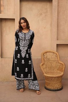 Floral Black Chikankari set, Chikankari Kurta Pant Set, Handmade Lucknowi Chikankari Kurti Casual Wear, Minimal look Kurta boho Fashion Introducing our stunning Black and White Chikankari Kurti and Palazzo Set--a captivating ensemble that seamlessly marries the classic elegance of monochrome with the intricate craftsmanship of Chikankari embroidery. Elevate your ethnic wardrobe with this timeless creation that exudes sophistication and charm for any occasion. Immerse yourself in the artistry of Chikankari embroidery, where skilled artisans have handcrafted every inch of this set with precision and care. The white Chikankari work intricately adorns the black canvas, creating a mesmerizing contrast that is both bold and graceful. The black and white color combination is a timeless choice, of Bohemian Cotton Sharara With Straight Kurta, Black Sharara With Chikankari Embroidery For Navratri, Anarkali Style Long Sleeve Pant Set With Chikankari Embroidery, Traditional Long Sleeve Pant Set, Traditional Long Sleeve Pant Set With Zari Work, Bohemian Mulmul Sharara For Festive Occasions, Bohemian Mulmul Sharara With Block Print, Traditional Full Length Embroidered Anarkali Set, Navratri Straight Kurta Sharara With Block Print