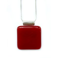 This eye-catching statement pendant is a solid, glowing deep red that changes colors with the light. This 1.5 inch by 1.5 inch pendant includes a silver chain. My one-of-a-kind fused glass jewelry is hand-made in Nashville, Tennessee. Each piece of hand-made fused glass jewelry is unique, with small variations that occur when working with glass, kilns, and color. Also, be sure to check out the matching earrings here in my store. Modern Red Necklace Perfect As A Gift, Modern Red Jewelry For Gifts, Amber Glass Necklace As Gift, Red Necklace With Large Pendant For Gifting, Modern Red Necklace For Gift, Red Large Pendant Jewelry For Gift, Red Jewelry With Large Pendant For Gift, Amber Glass Necklace For Gift, Necklace With Large Glass Pendant As Gift