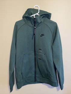 Nike Sportswear Tech Fleece Men's Full-Zip Hoodie Green Size M BV3701-337. Nike Fleece Moisture-wicking Hoodie, Nike Functional Fleece Hoodie, Sporty Long Sleeve Hoodie With Ykk Zipper, Green Drawstring Hood Sweats For Sports, Nike Moisture-wicking Hoodie For Outdoor Activities, Functional Hooded Moisture-wicking Tracksuit, Functional Moisture-wicking Hooded Tracksuit, Nike Sports Hoodie Activewear, Sports Half-zip Fleece Sweatshirt