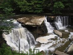 there is a large waterfall in the woods