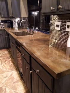 a counter top in a kitchen next to a sink