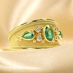 Make an unforgettable entrance with this dazzling gold Emerald Ring - encrusted with dazzling diamonds and fit for royalty! It's the perfect pick to add extravagant style and sparkle to your wardrobe and make an undeniable statement! 100% handmade in our workshop. Metal: 14K Gold| 18K Gold Gemstones: Emeralds | weight 0,68 ct Diamonds | weight 0,08 ct Discover the art of personalization as you select your dream jewelry, choosing the perfect gemstone that resonates with your unique style. Our ded Luxury Gold Oval Emerald Ring, Luxury Gold Emerald Ring For Formal Occasions, Gold Emerald Diamond Ring With Accents, Gold Rings With Single Cut Diamonds And Emerald, Luxury Gold Emerald Open Ring, Elegant Gold Emerald Ring, Exquisite Gold Emerald Ring For Anniversary, Yellow Gold Diamond Ring With Bling, Elegant Gold Emerald Ring For Wedding