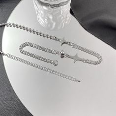 ✦ This choker necklace features a unique combination of star and cross charms, along with a half cuban chain and half silver beads. It has an edgy and cool aesthetic, making it a great gift for a boyfriend or as a matching accessory. Its mismatched style adds a touch of uniqueness, perfect for casual outings and adding fun to any outfit. ----------- DETAILS ----------- - Color: Silver - Size (Length): 50cm - Materials: Stainless Steel - SKU: O28 Gift For A Boyfriend, Cool Aesthetic, Y2k Necklace, Basic Jewelry, Crystal Hoop Earrings, A Boyfriend, Chain Choker Necklace, Matching Accessories, Cross Charms